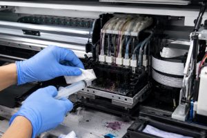 How to clean a clogged nozzle in an UV printer